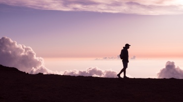 Silhouette of a man walking outdoors