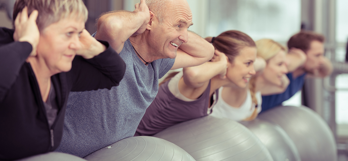 Diverse group exercising on space hoppers