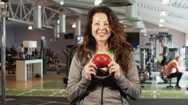 female-personal-trainer-holding-kettle-bell