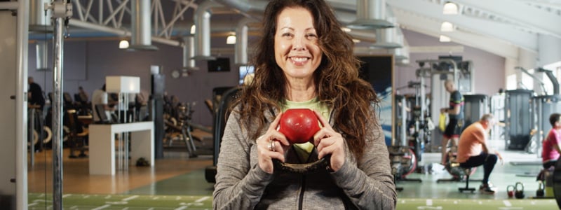 female-personal-trainer-holding-kettle-bell