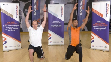 Olympian Dave Ryding and Davd Lloyd Trainer performing lunges