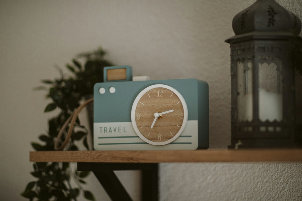 An alarm clock on a shelf.