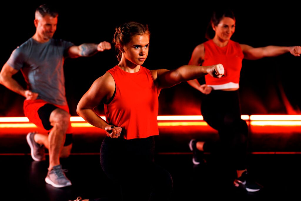 Three people in a martial arts class.