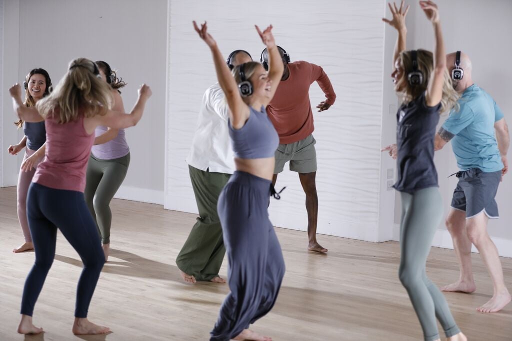 People in a dance meditation class at David Lloyd Clubs.